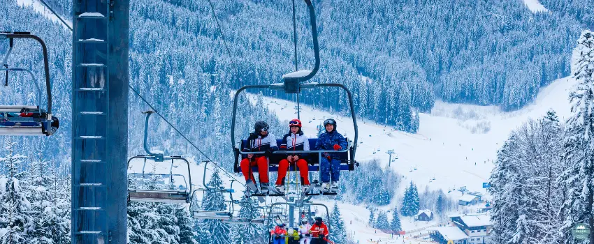 NDL-A group of skiers sitting on a ski lift
