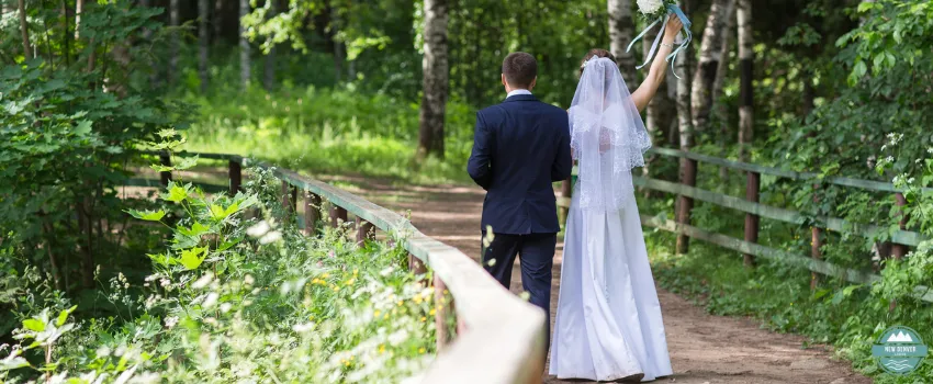 NDL - Two wedding couples posing in their while walking on a pathway in the forest 